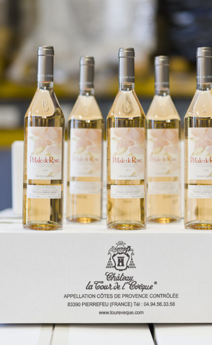 _AL24478 pink wine bottles with silver cap of le pétale de rose, organic rosé wine on white box of barbeyrolles vineyard, france